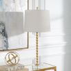 This table lamp features a gold leaf finish, stacked hourglass design, crystal base, and an ivory linen shade, exuding elegance and timeless sophistication. Sold as a set of two.