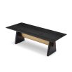 A statement dining table by Liang & Eimil with a black and brass finish