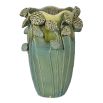 Green vase featuring lotus flowers