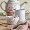 Set of 2 embossed ceramic bowls, with fur leaf print