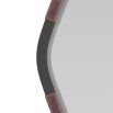 Diamond mirror wrapped in oxblood leather with bronze accents