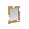 Textural gold mirror reminiscent of a puzzle shape 