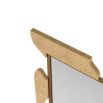 Textural gold mirror reminiscent of a puzzle shape 