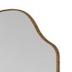 Arched mirror delicately framed in antique brass