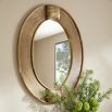 Oval mirror with thick gold frame