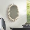 Oval mirror with metallic waved frame