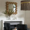 Square mirror with a thick gold scalloped frame