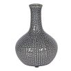 Grey vase with white bobbin design.