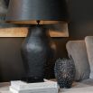 Large black metal table lamp with organic textured finish, shade not included