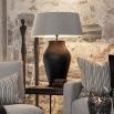 Large black metal table lamp with organic textured finish, shade not included